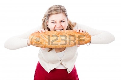 12803805-hungry-woman-holding-and-biting-loaf-of-bread-isolated-on-white-background.jpg