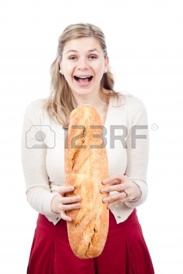 12803867-happy-young-woman-laughing-and-holding-loaf-of-bread-isolated-on-white-background.jpg